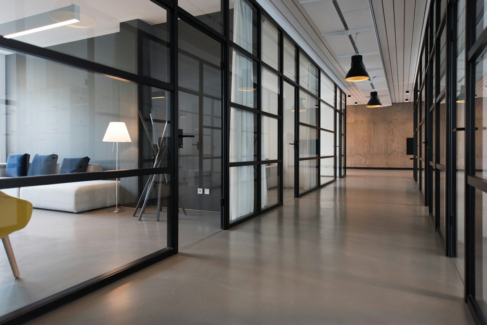 Bright, clean office space with pearl white furnishings and plants